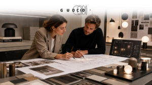 Interior designer and lighting design partner collaborating on a project layout with lighting plans and fixture samples